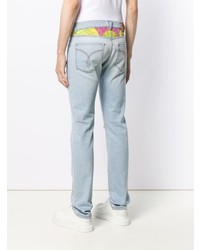 hellblaue Jeans mit Destroyed-Effekten von Versace