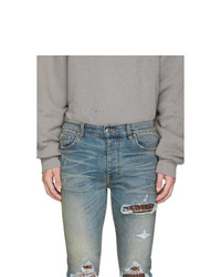 hellblaue Jeans mit Destroyed-Effekten von Amiri