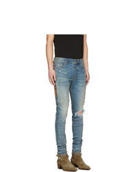 hellblaue Jeans mit Destroyed-Effekten von Amiri