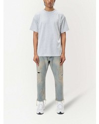 hellblaue Jeans mit Destroyed-Effekten von John Elliott