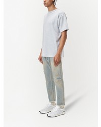 hellblaue Jeans mit Destroyed-Effekten von John Elliott