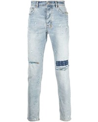 hellblaue Jeans mit Destroyed-Effekten von Ksubi