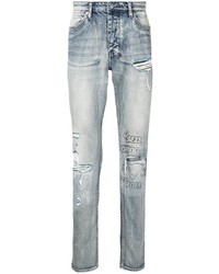 hellblaue Jeans mit Destroyed-Effekten von Ksubi