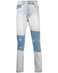 hellblaue Jeans mit Destroyed-Effekten von Ksubi