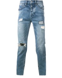 hellblaue Jeans mit Destroyed-Effekten von Ksubi