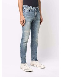 hellblaue Jeans mit Destroyed-Effekten von Haikure