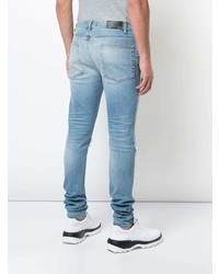 hellblaue Jeans mit Destroyed-Effekten von Amiri