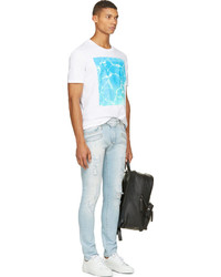 hellblaue Jeans mit Destroyed-Effekten von Balmain