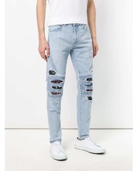 hellblaue Jeans mit Destroyed-Effekten von Marcelo Burlon County of Milan