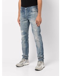 hellblaue Jeans mit Destroyed-Effekten von John Elliott