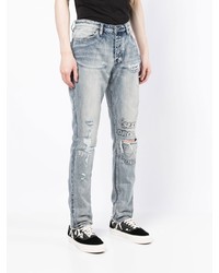 hellblaue Jeans mit Destroyed-Effekten von Ksubi