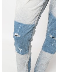 hellblaue Jeans mit Destroyed-Effekten von Ksubi