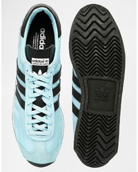 hellblaue Leder Turnschuhe von adidas