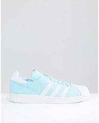 hellblaue Turnschuhe von adidas