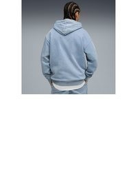 hellblauer Pullover mit einem Kapuze von Puma