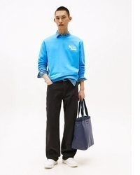 hellblauer Pullover mit einem Rundhalsausschnitt von Tommy Jeans