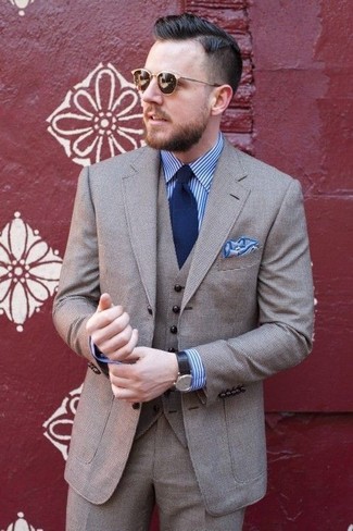 Grauen Wollanzug kombinieren – 411 Herren Outfits: Erwägen Sie das Tragen von einem grauen Wollanzug und einem weißen und blauen vertikal gestreiften Businesshemd für einen stilvollen, eleganten Look.
