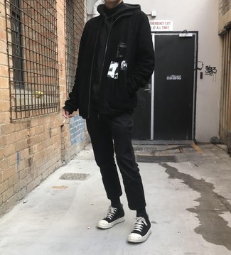 schwarzer bedruckter Pullover mit einem Reißverschluß von Ader Error