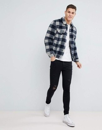 schwarze enge Jeans mit Destroyed-Effekten von Amiri