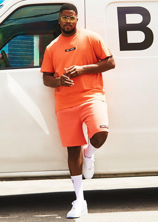 orange bedrucktes T-Shirt mit einem Rundhalsausschnitt von Puma