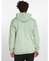 mintgrüner bedruckter Pullover mit einem Kapuze von Just Rhyse