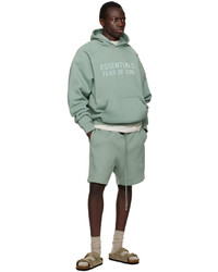 mintgrüner Pullover mit einem Kapuze von Essentials