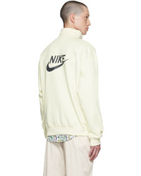 mintgrüner Pullover mit einem Reißverschluss am Kragen von Nike