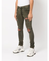 olivgrüne enge Jeans mit Destroyed-Effekten von Amiri