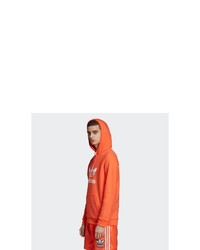 orange bedruckter Pullover mit einem Kapuze von adidas Originals