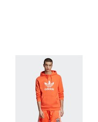 orange bedruckter Pullover mit einem Kapuze von adidas Originals