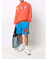 orange bedruckter Pullover mit einem Kapuze von Moschino