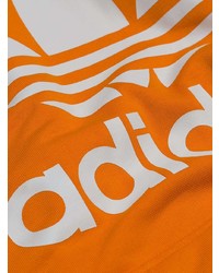 orange bedruckter Pullover mit einem Kapuze von adidas