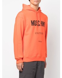 orange bedruckter Pullover mit einem Kapuze von Moschino