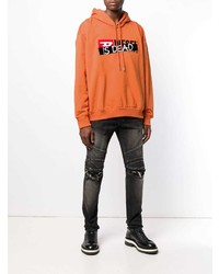 orange bedruckter Pullover mit einem Kapuze von Diesel