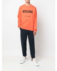orange bedrucktes Fleece-Sweatshirt von Moschino