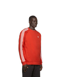 orange bedrucktes Sweatshirt von adidas Originals