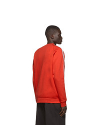 orange bedrucktes Sweatshirt von adidas Originals