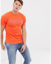 orange bedrucktes T-Shirt mit einem Rundhalsausschnitt von Calvin Klein