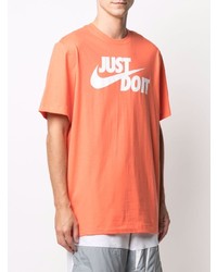 orange bedrucktes T-Shirt mit einem Rundhalsausschnitt von Nike