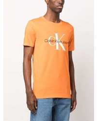 orange bedrucktes T-Shirt mit einem Rundhalsausschnitt von Calvin Klein Jeans