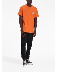 orange bedrucktes T-Shirt mit einem Rundhalsausschnitt von Moschino