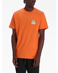 orange bedrucktes T-Shirt mit einem Rundhalsausschnitt von Moschino