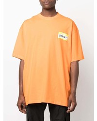 orange bedrucktes T-Shirt mit einem Rundhalsausschnitt von Vetements