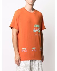 orange bedrucktes T-Shirt mit einem Rundhalsausschnitt von Nike