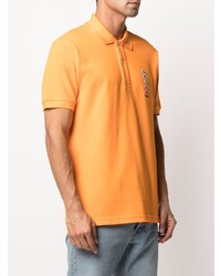 orange besticktes Polohemd von Lacoste