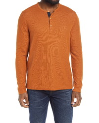 orange horizontal gestreiftes Langarmshirt mit einer Knopfleiste