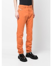 orange Jeans mit Destroyed-Effekten von Diesel