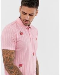 rosa bedrucktes Polohemd von ASOS DESIGN