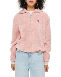 rosa Pullover mit einem Reißverschluss am Kragen