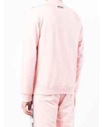 rosa Pullover mit einem Reißverschluss am Kragen von Moschino